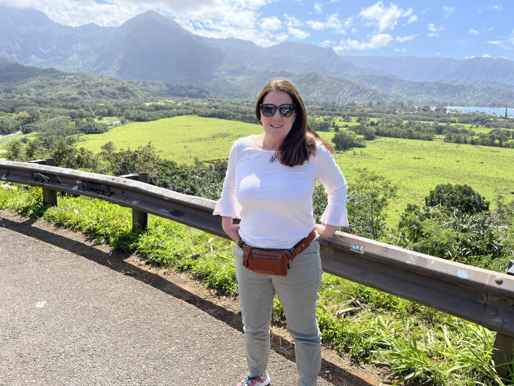 Portrait of a woman with Kauai landscape in the background.