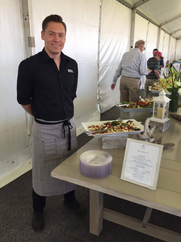 staffing-services-caterer-smiling-at-the-service-companies-event